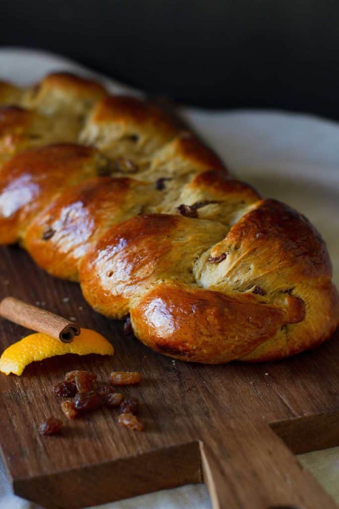 Hot Cross Brioche Braid on a wooden board