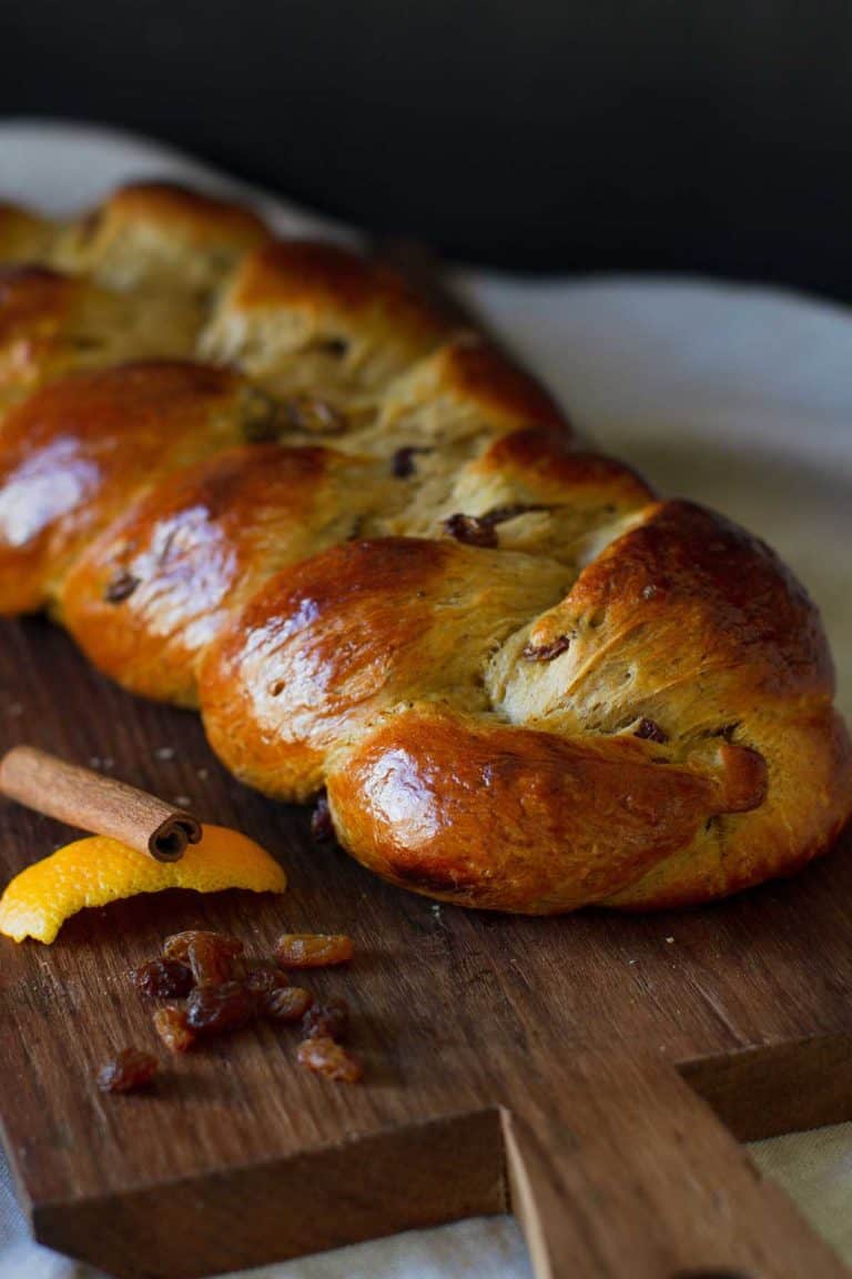 Hot Cross Brioche Braid on a wooden board