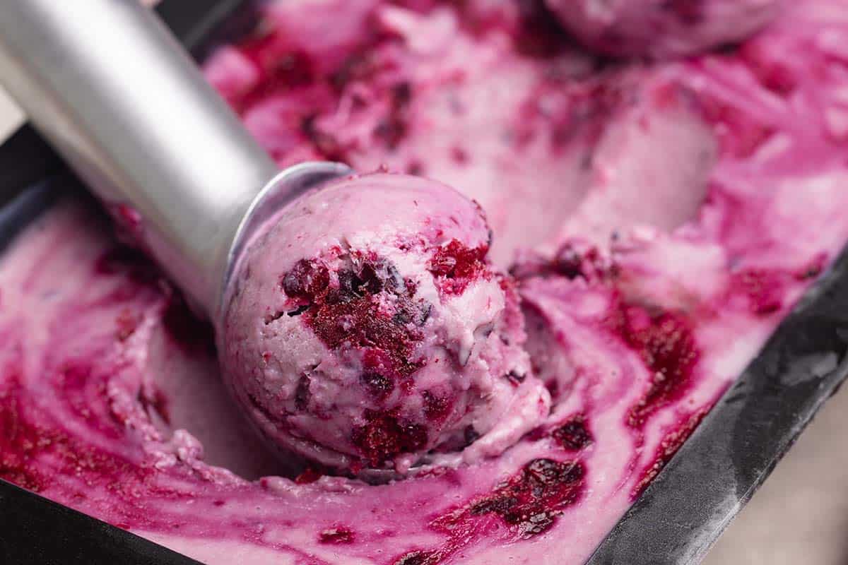 Close-up of a scoop of boysenberry ice cream.
