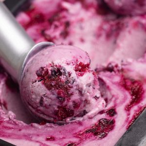 Close-up of a scoop of boysenberry ice cream.