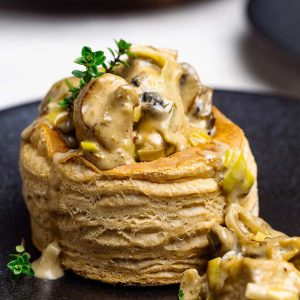 Mini chicken pot pie a black plate.