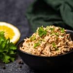 A black bowl filled with smoked tuna tip.