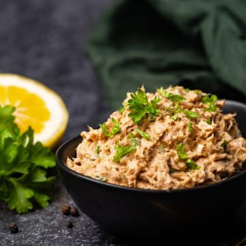 A black bowl filled with smoked tuna tip.