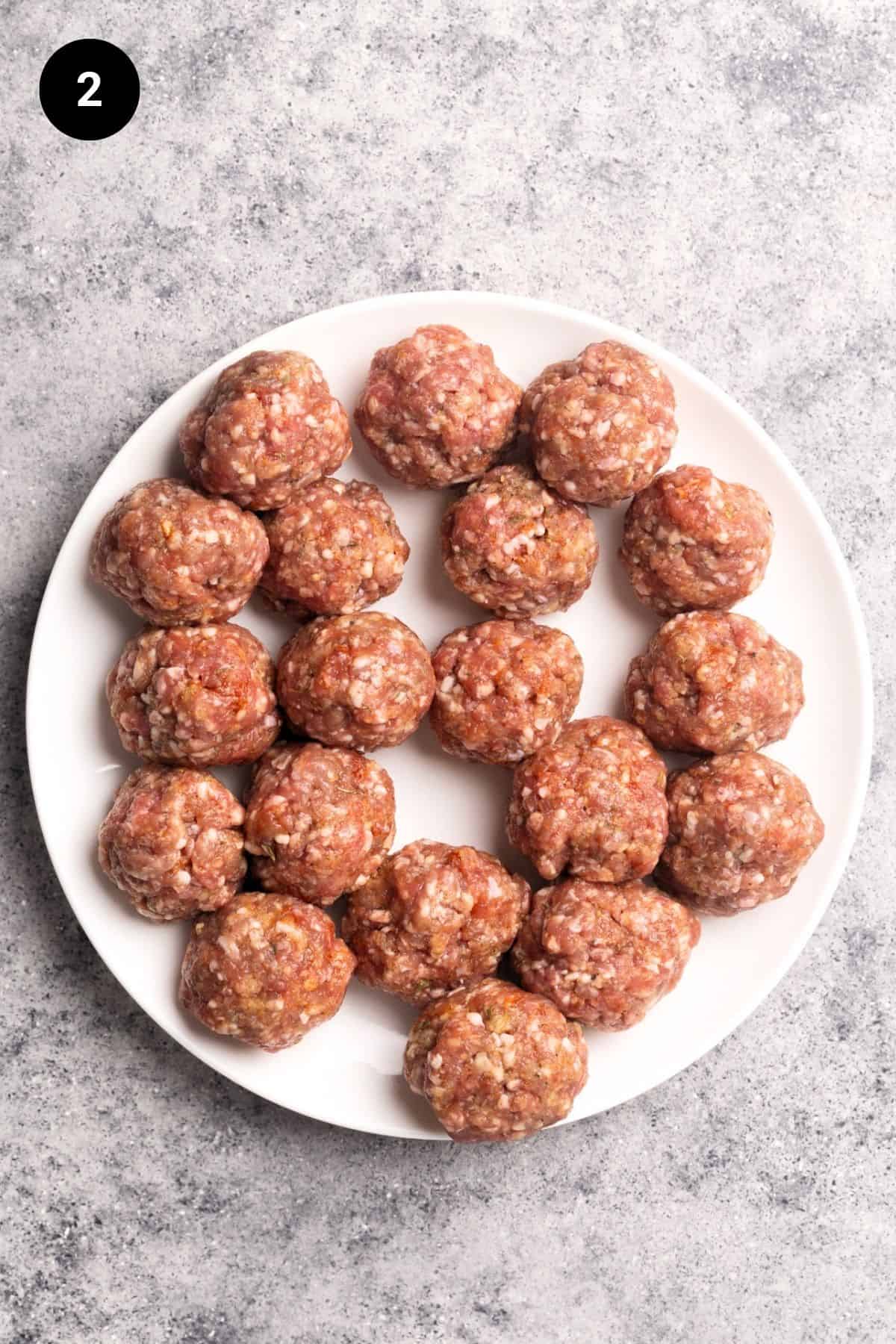 Shaped meatballs on a plate.