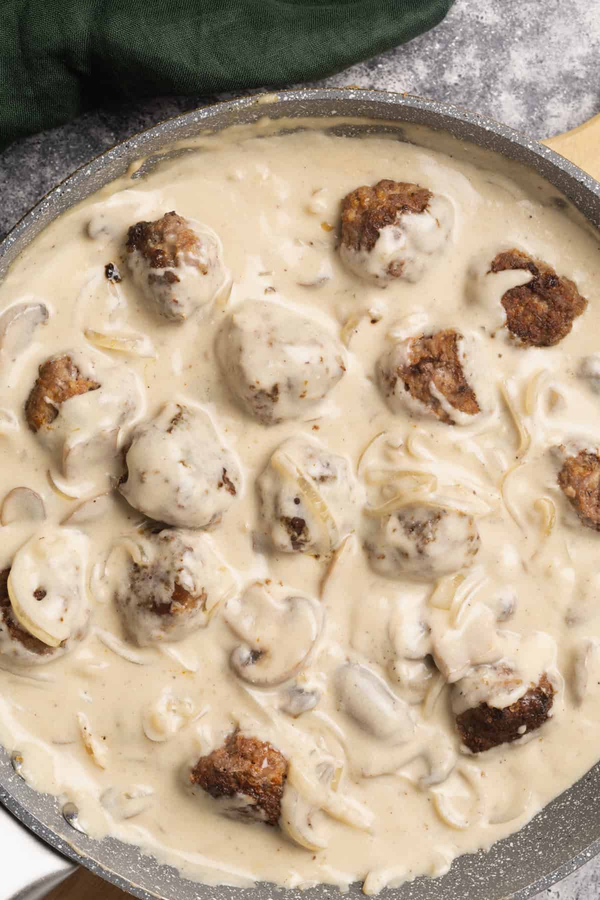 Meatball stroganoff sauce in a pan.
