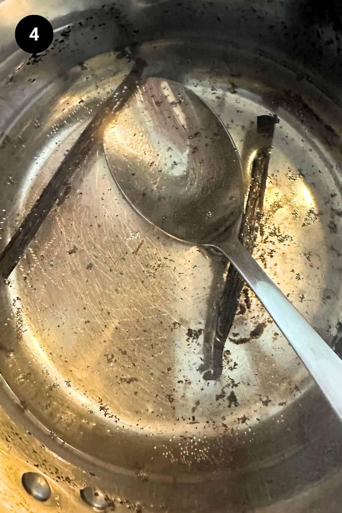 Vanilla syrup in a saucepan infusing.