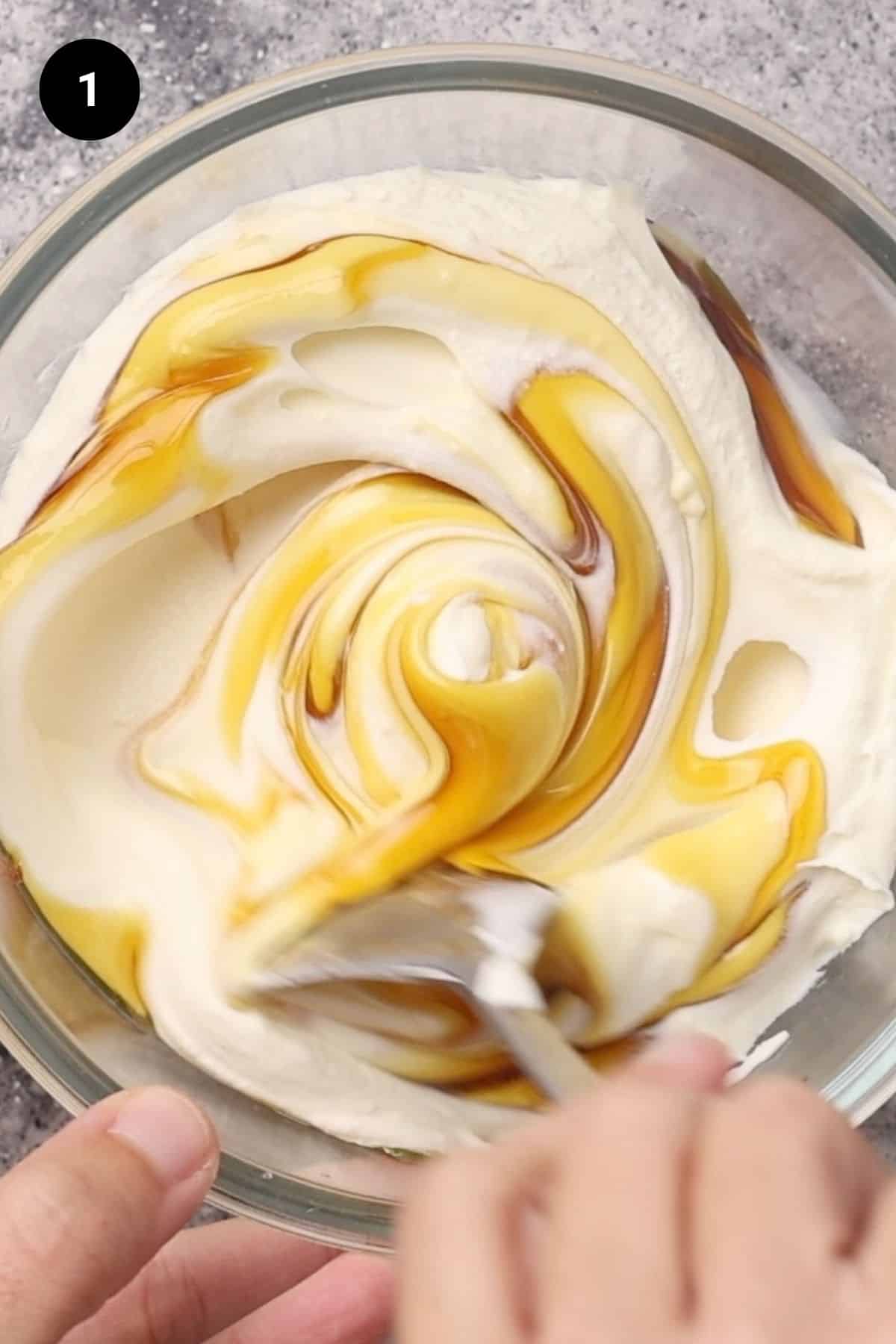 Greek yogurt and honey mixed in a bowl.