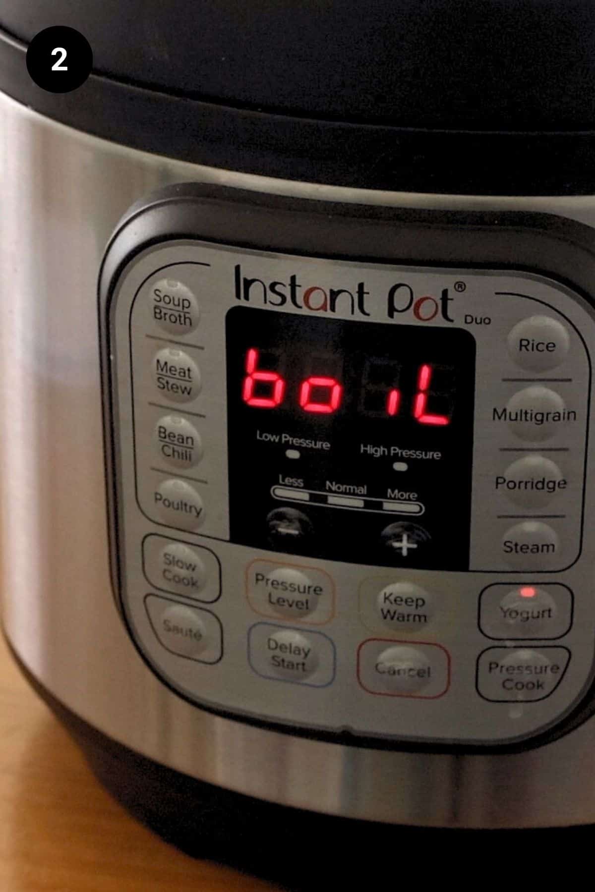 Instant Pot being set to boil on the yogurt function.