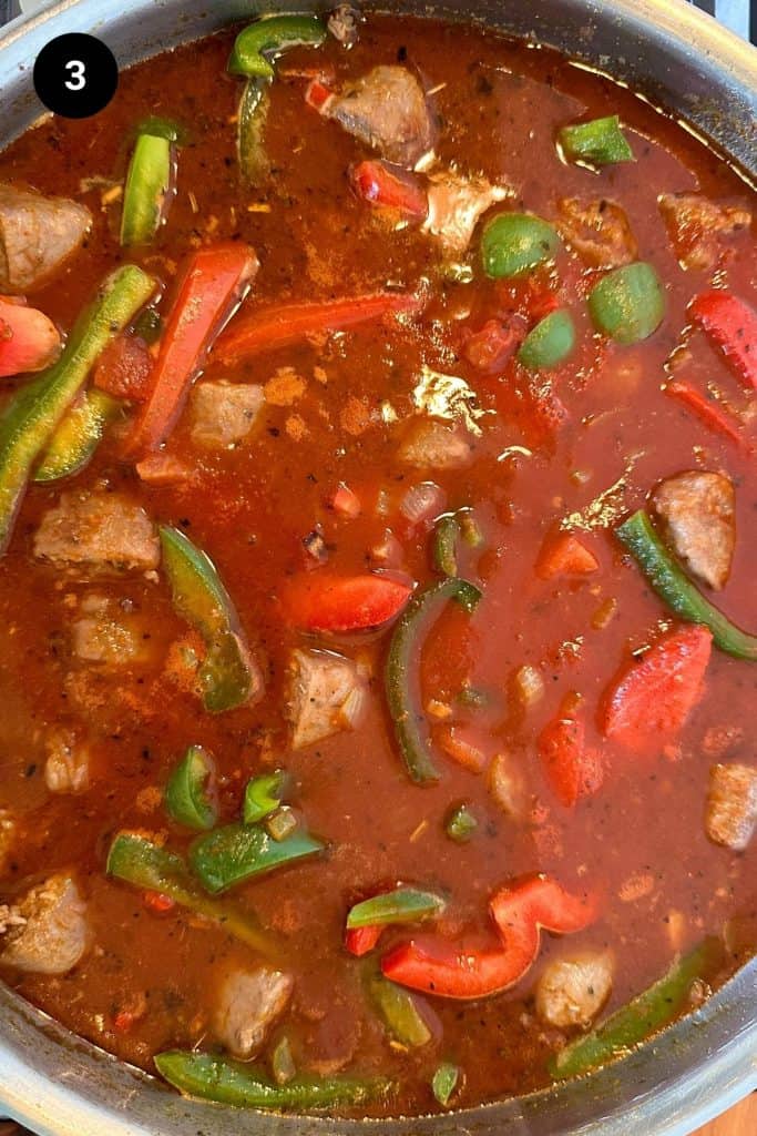 Italian goulash being cooked in a large pan.