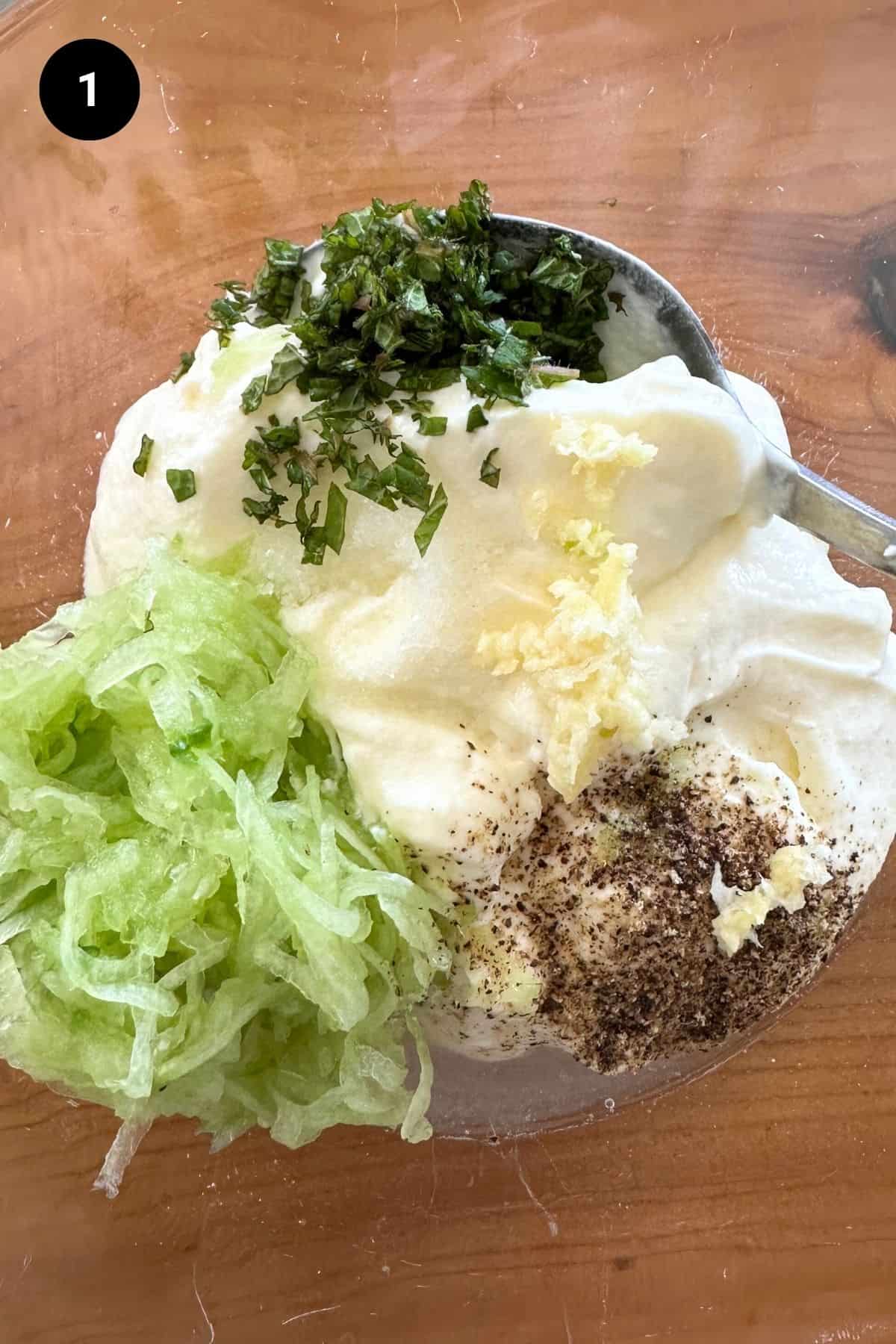 All ingredients in a glass bowl before mixing.