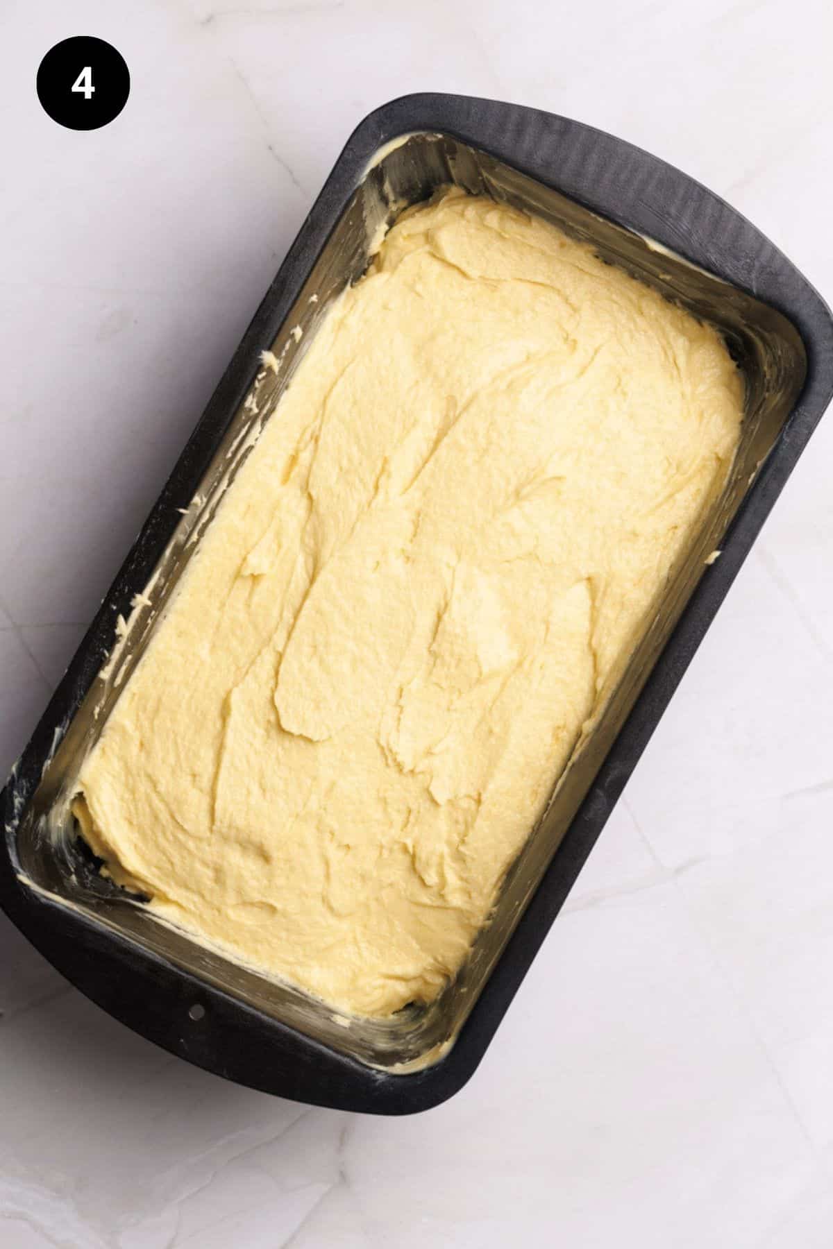 Cake batter in a greased loaf tin.