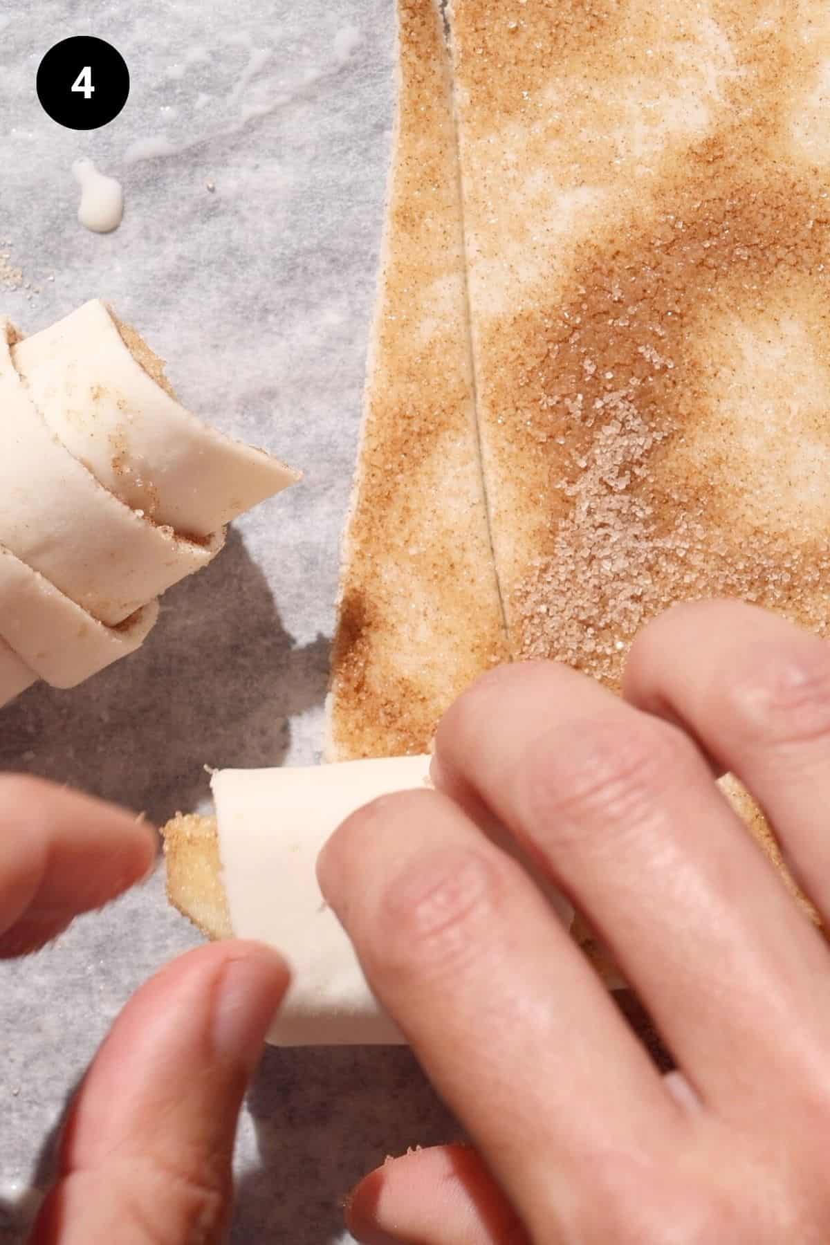 Apple croissants being rolled up.