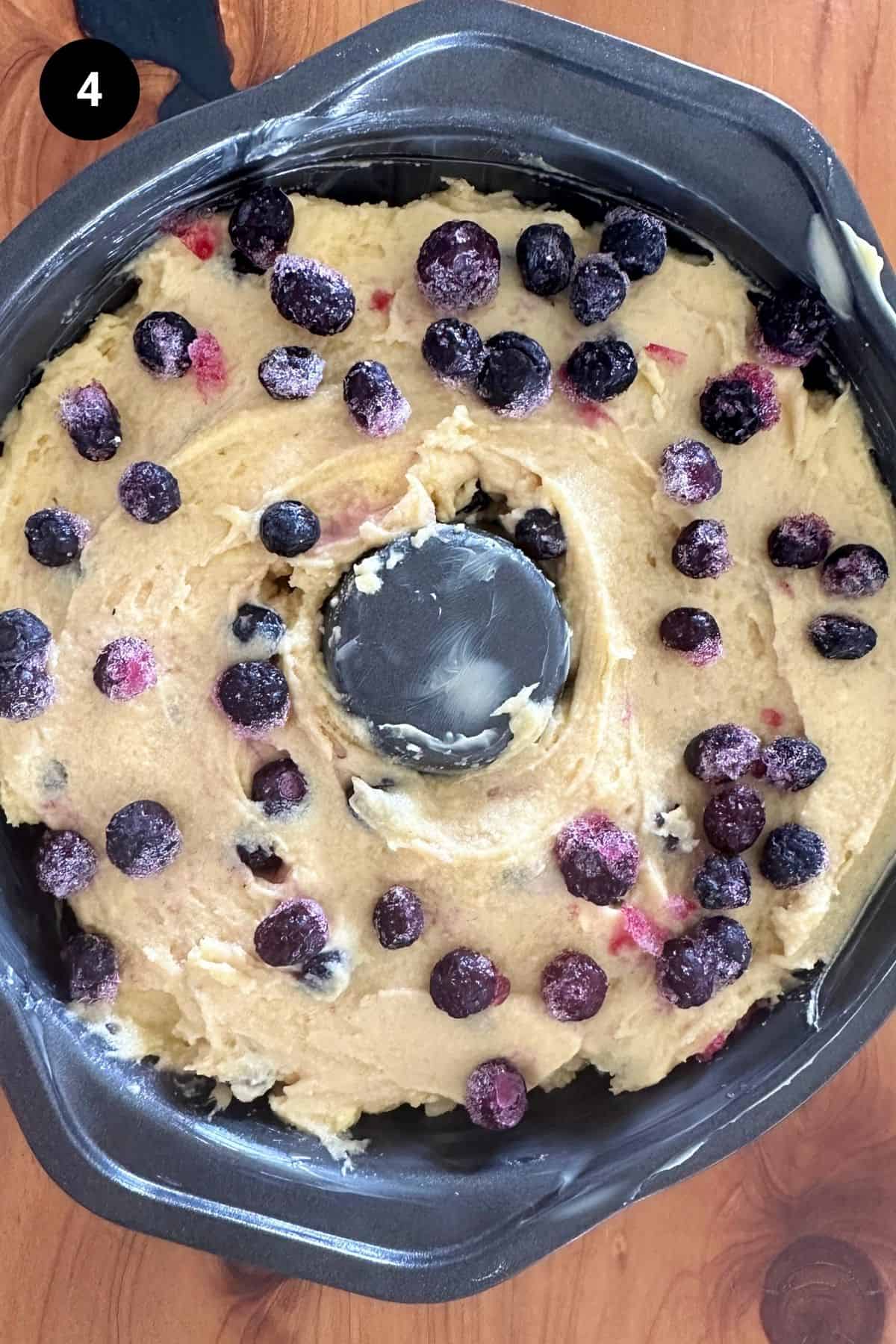Cake batter in a greased ring tin.