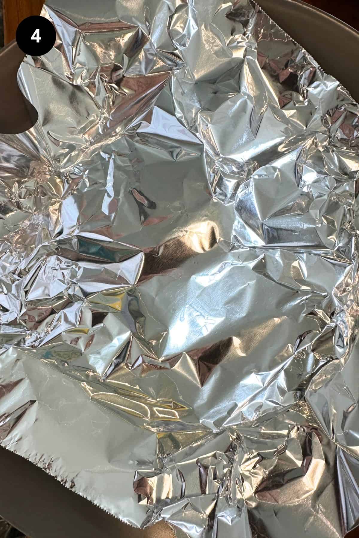 Tinfoil over cooked meat.