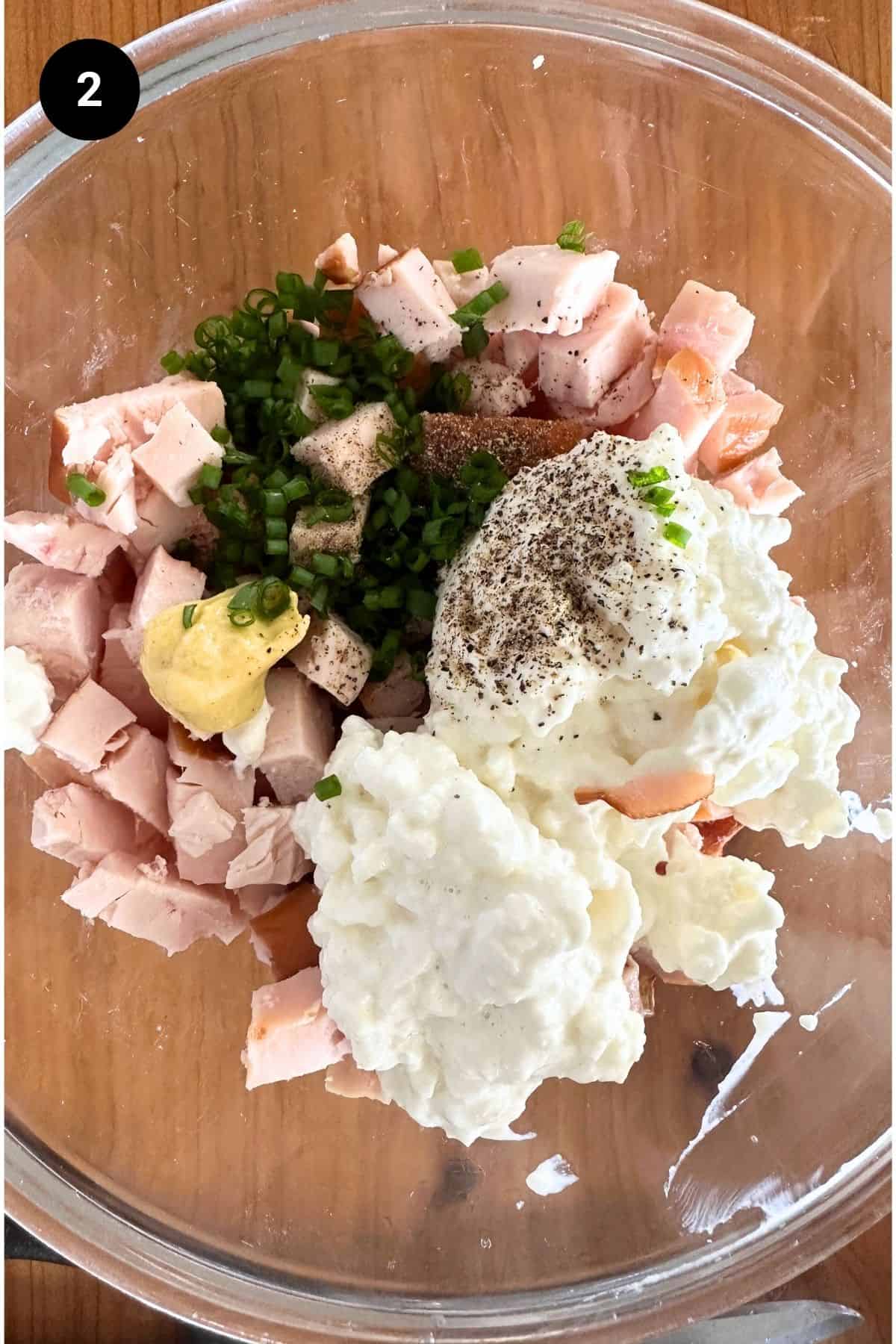 Ingredients for the salad in a bowl ready to be stirred.