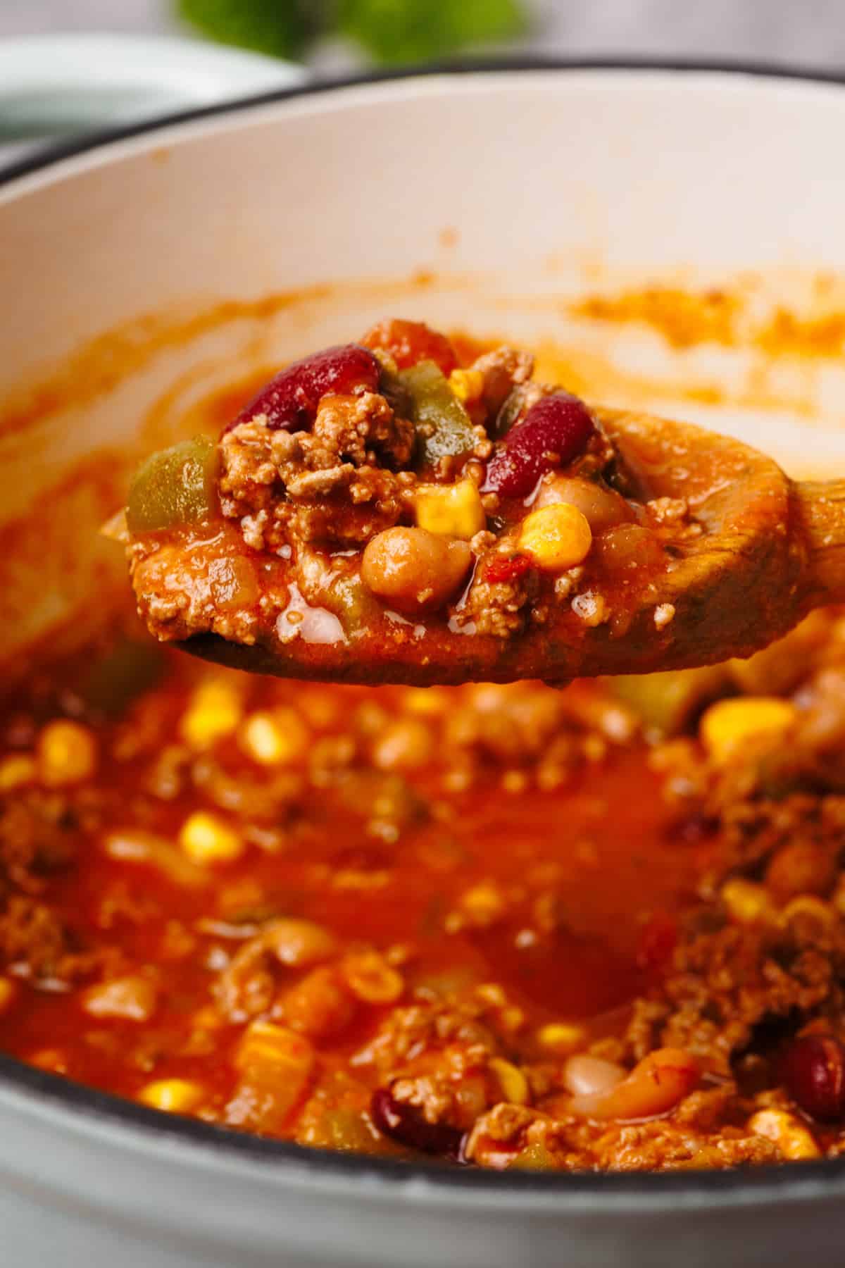 Chili on a wooden spoon.