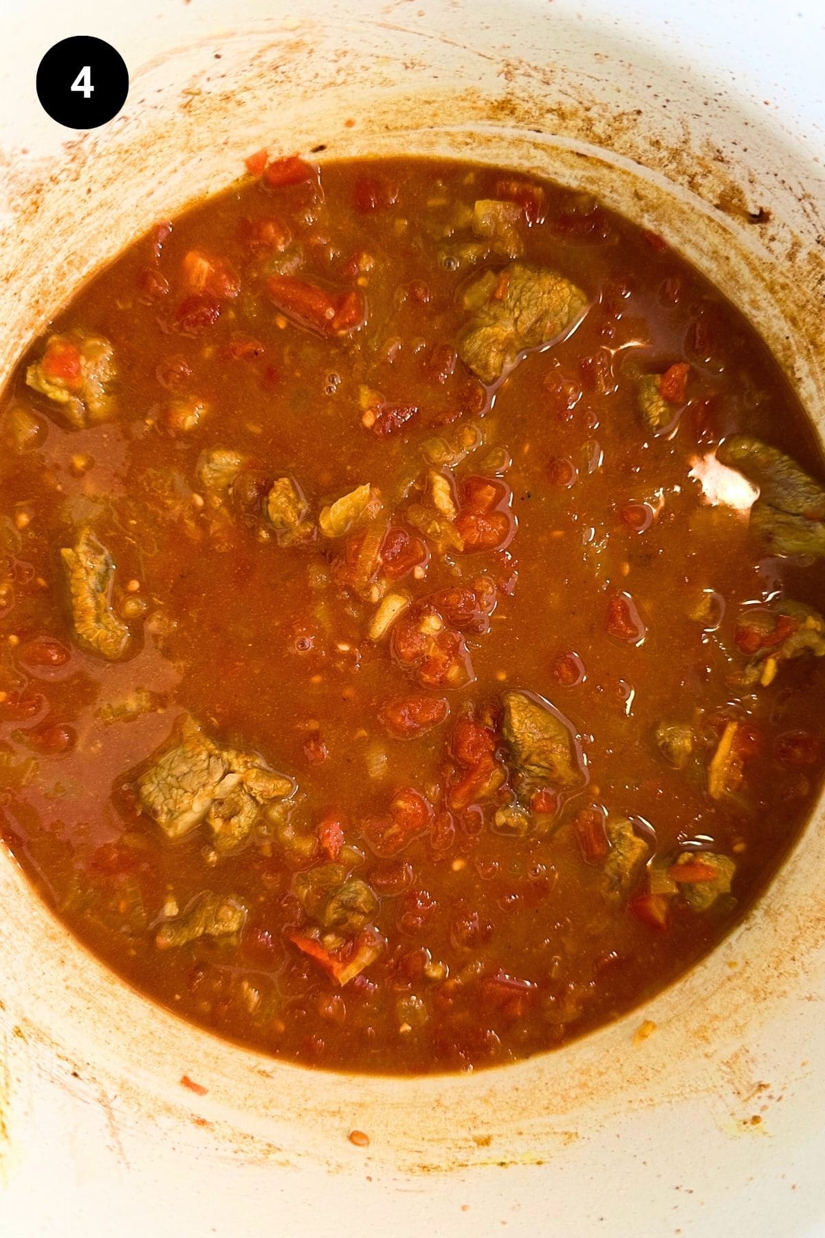 Diced lamb before being cooked in a Dutch oven.