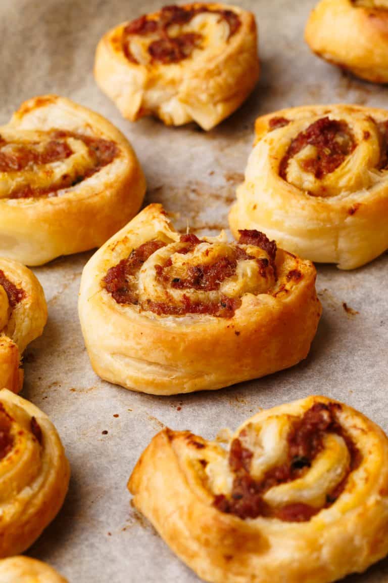 Baked lamb pinwheels on a baking sheet.