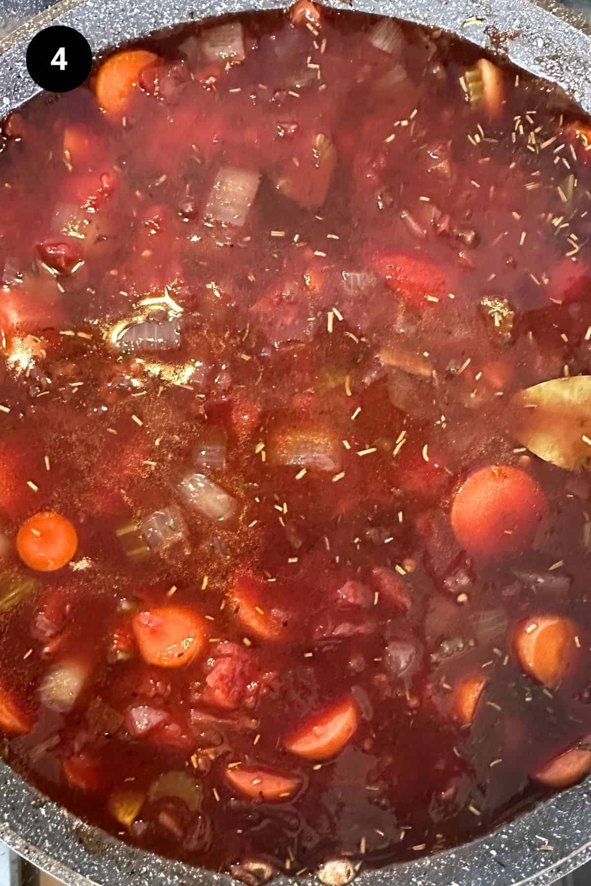 Sauce simmering in a pan.