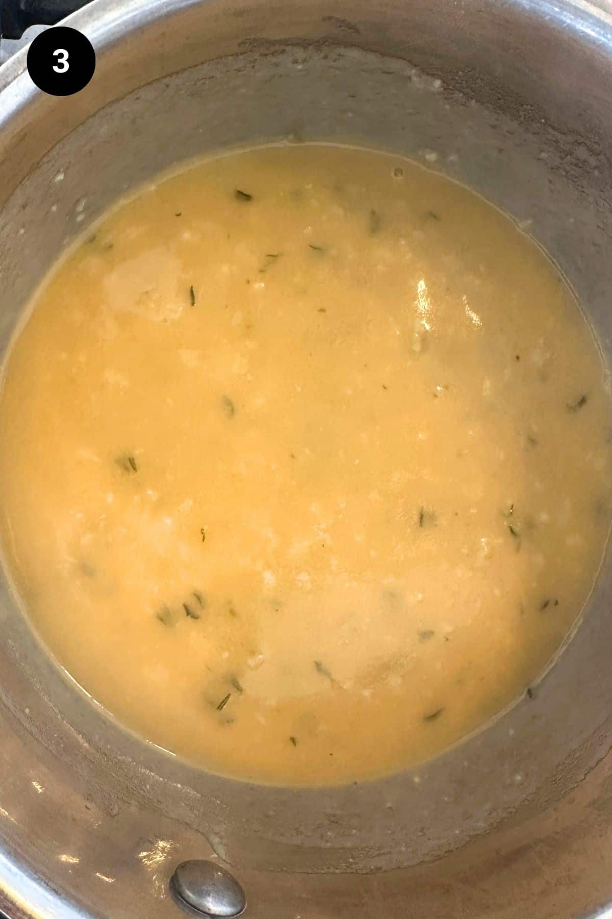 Flour and stock has been added to the garlic sauce.