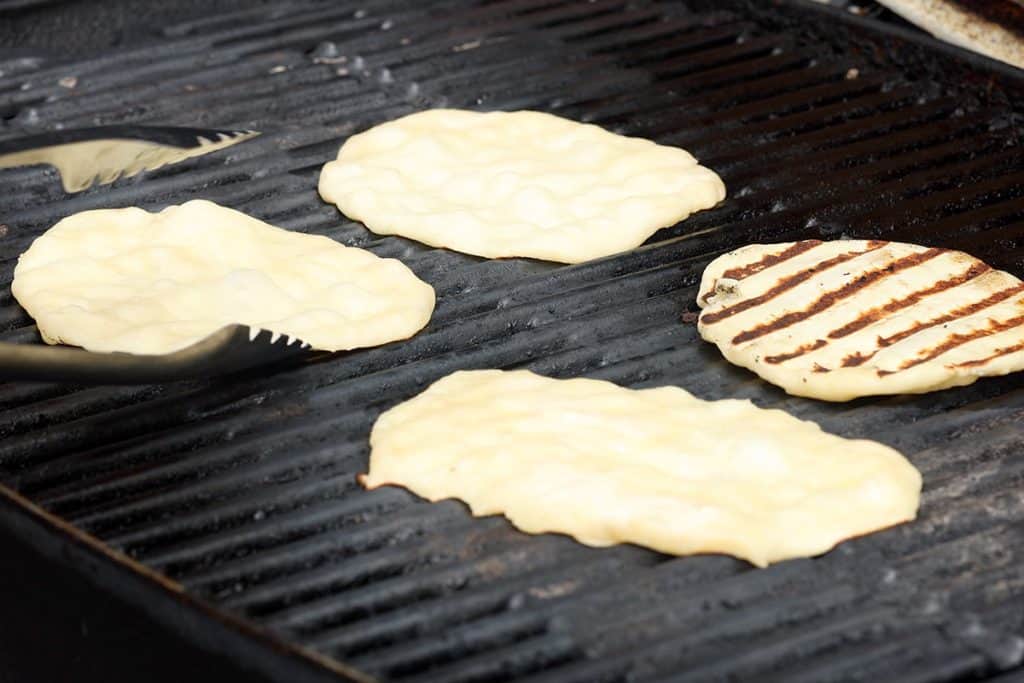 Flatbreads being grilled.