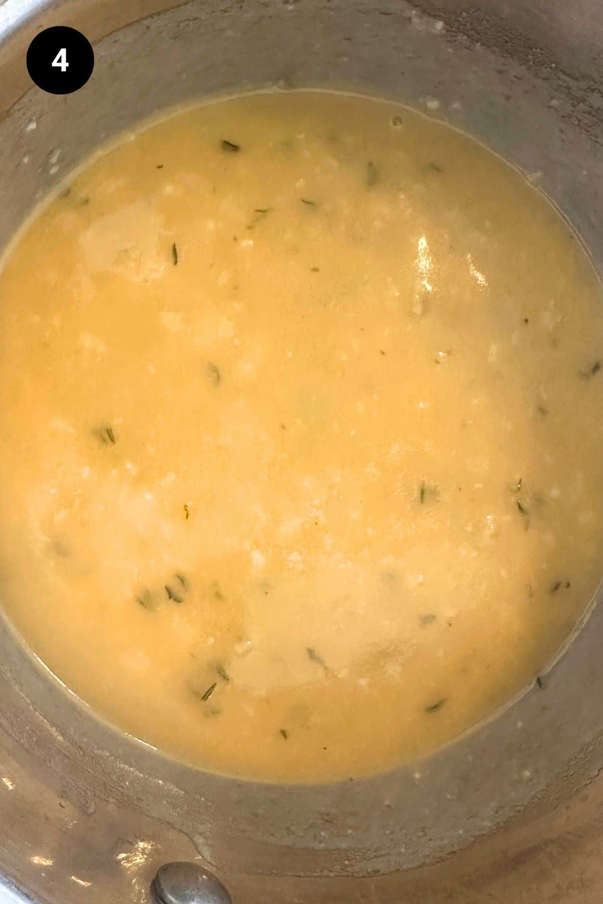 Flour and stock has been added to the garlic sauce.