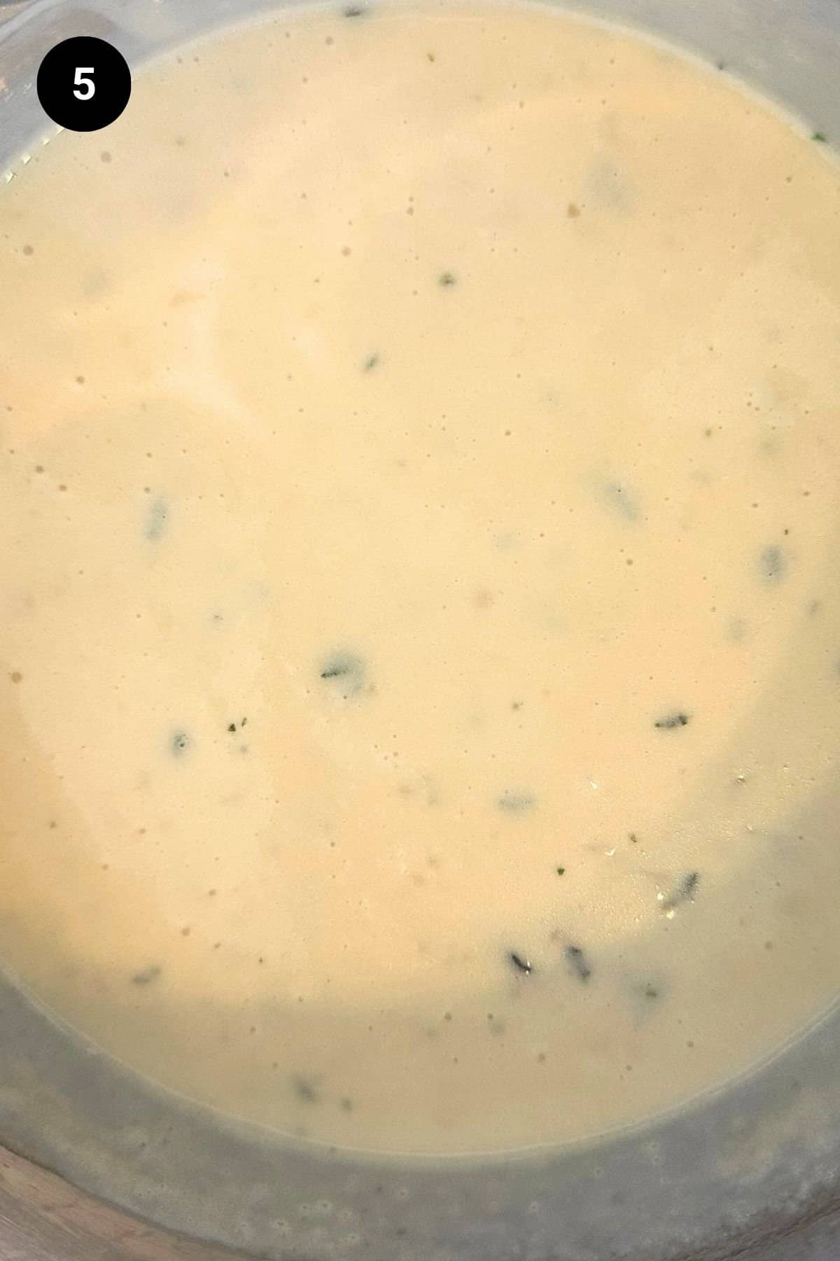 Heavy cream has been added to the garlic sauce.