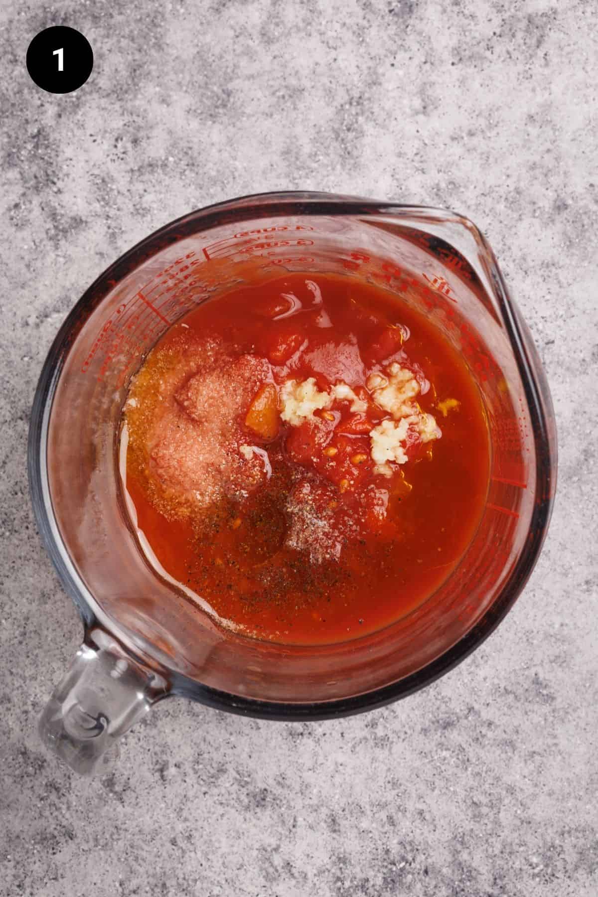 Ingredients for a no cook pizza sauce in a glass jug before being blended.