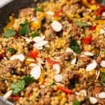 Lamb couscous in a grey pan.