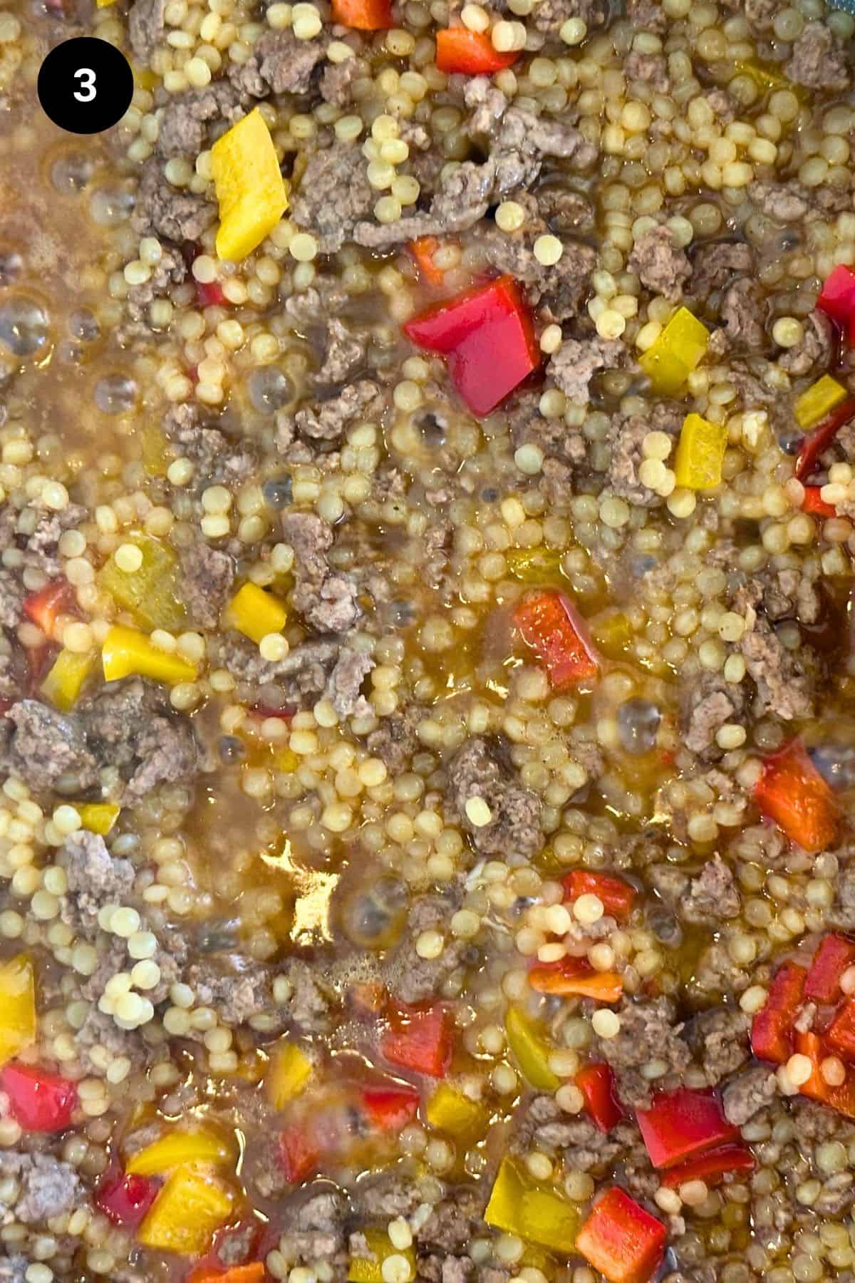Close-up of lamb couscous thickening up.