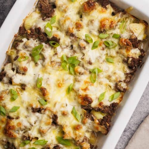 Hamburger and potato casserole in a large baking dish.
