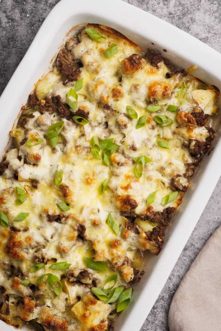 Hamburger and potato casserole in a large baking dish.