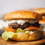 Hamburger on a wooden board.