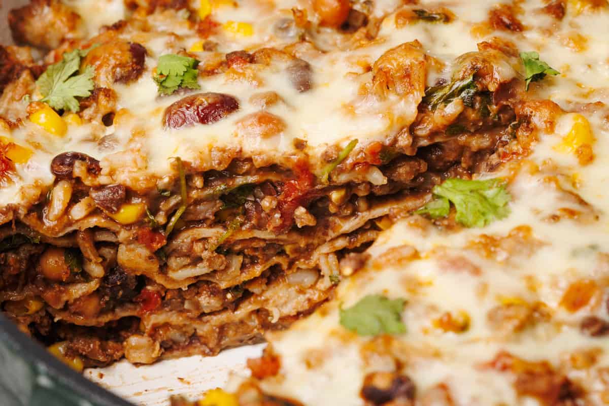 Close-up view of the Mexican Lasagna with a slice taken out of it.