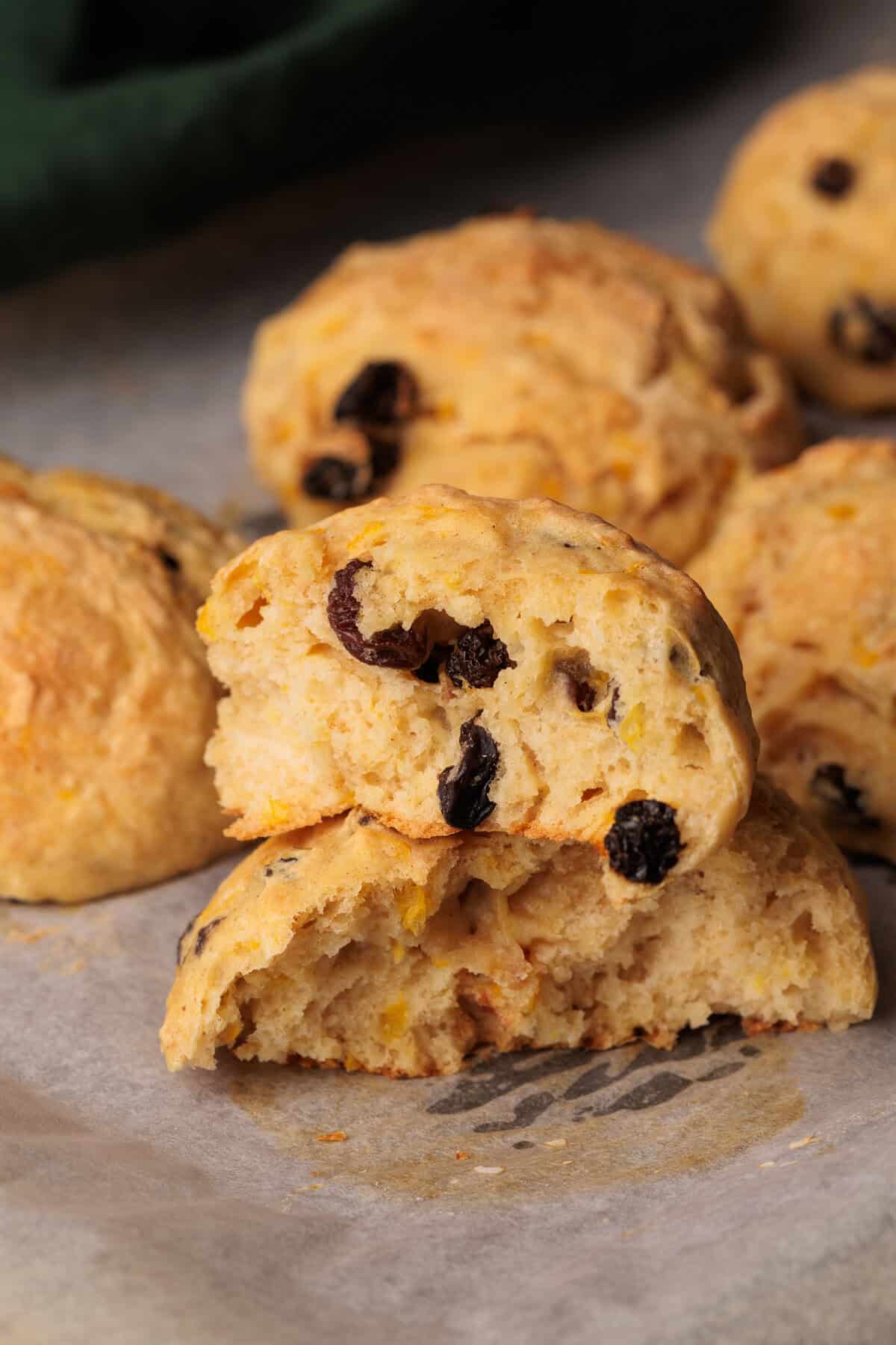Spiced Fruit Bread Rolls on parchment paper.